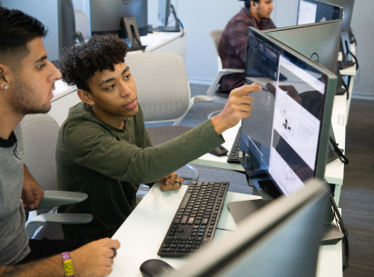 two male students at computer