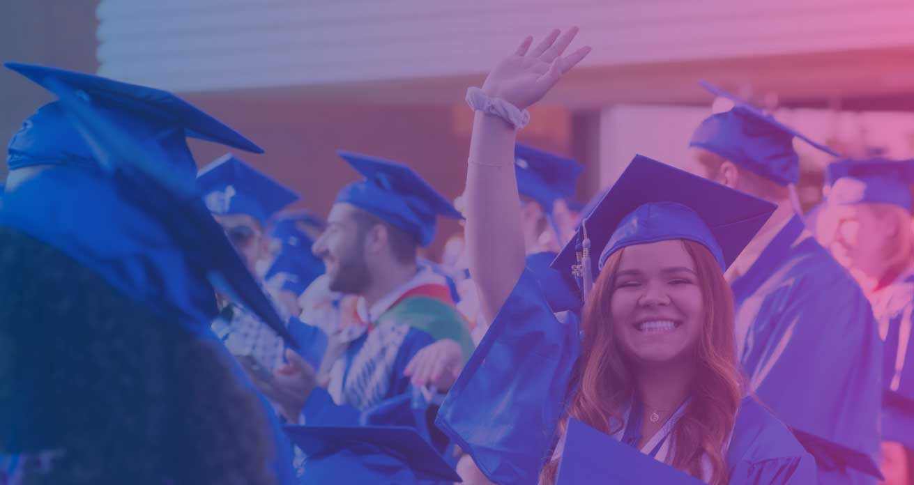 waving happy graduate in cap and gown