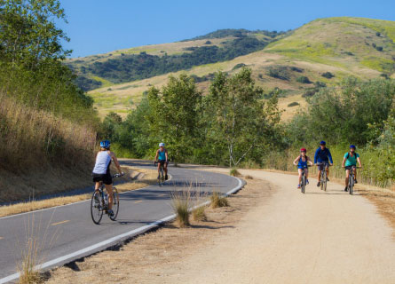 beautiful hills and cyclists on path