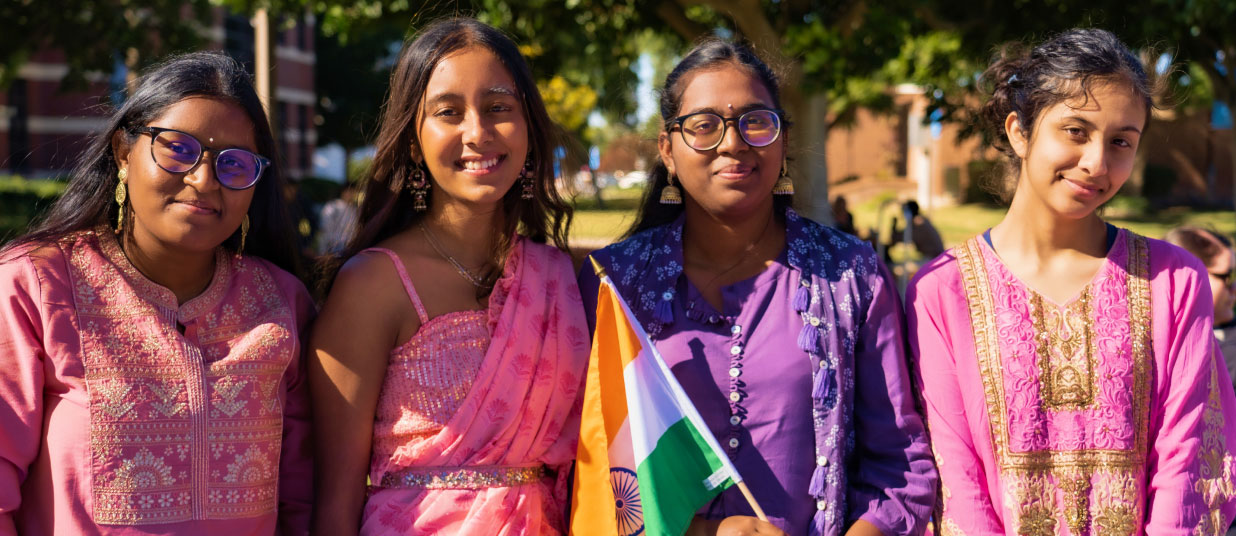 women in colorful dresses