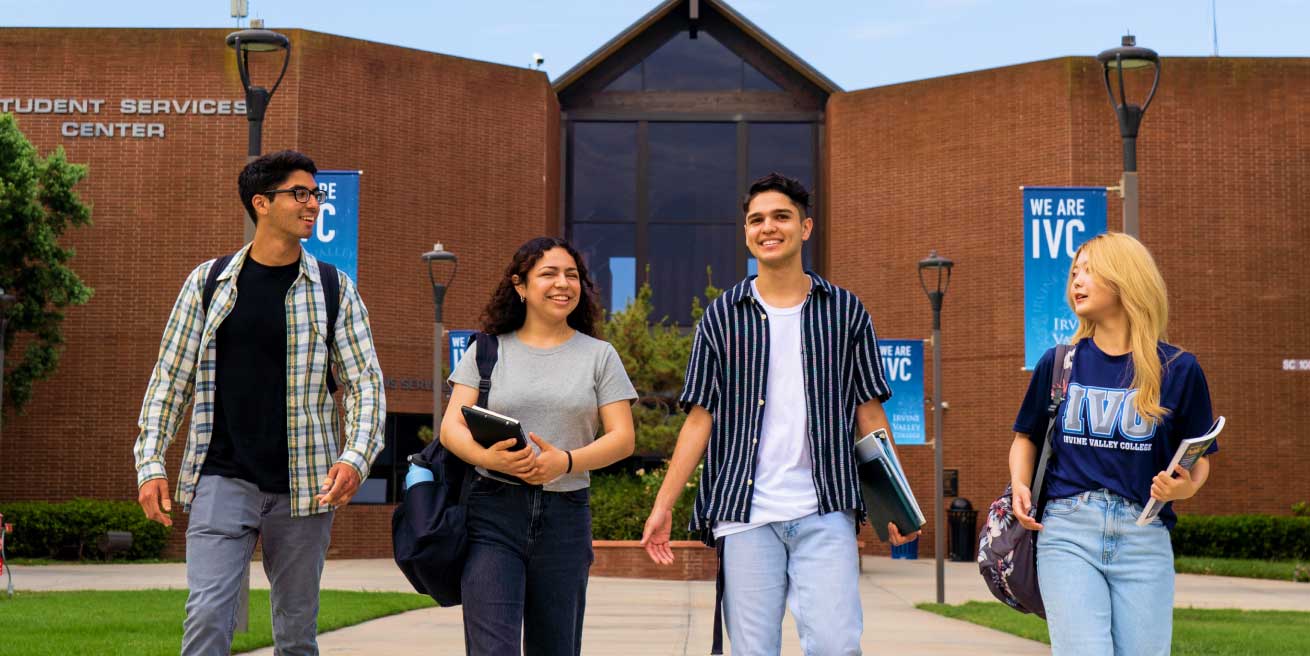 happy students with backpacks and books