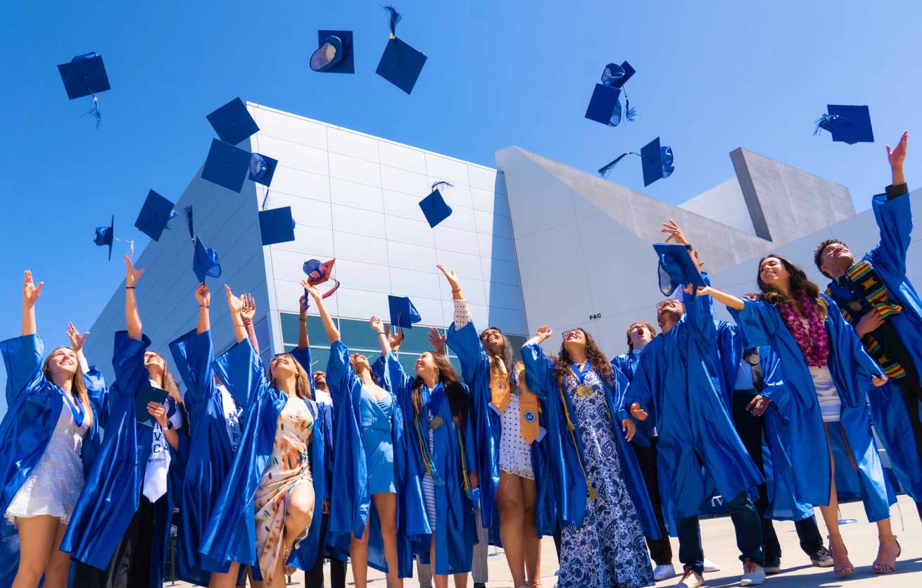  Graduates toss caps in the air